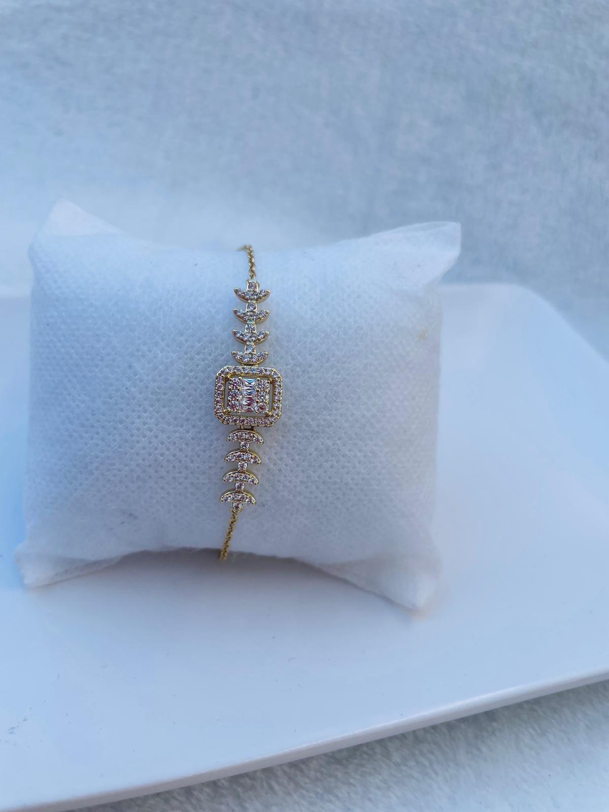 Delicate Gold Plated Bracelet with Square Zirconia Center and Botanical Details